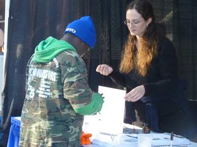 Carrie Kouadio works with a student